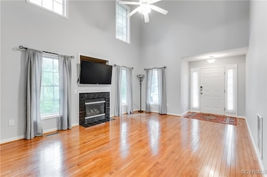 Unfurnished living room with light wood-style floo