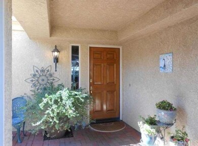 Covered front entry has access to garage.