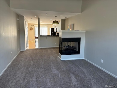 Open flow plan into Living /Dining/Kitchen area with new neutral carpet, dual sided fireplace, and nice wall space for large size television.