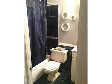 Bath. Hall Bath; Tiled Flooring and Shower/ Bath c