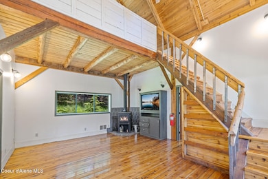 Home interior-LR & dining with woodstove