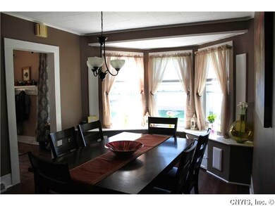 Dining Room. living room with charming bay windows