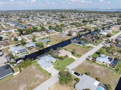 Aerial view featuring a water view and a residential view