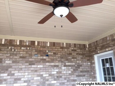 THIS PHOTO SHOWS TV OUTLET ON COVERED BACK PORCH WITH LIGHTED CEILING FAN.   CEILING FANS ARE ALSO IN ALL BEDROOMS AND FAMILY ROOM.