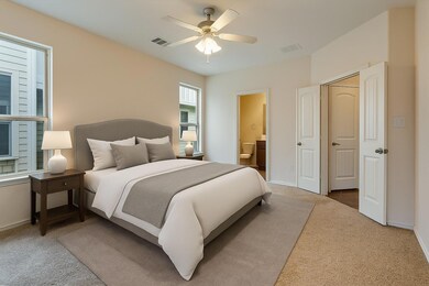 Bedroom with carpet floors, ensuite bath, ceiling