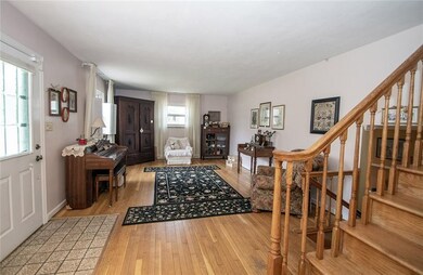 Enter into beautiful, large living room with beautiful hardwood floors.