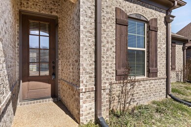 Entrance to property with brick siding