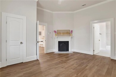 Unfurnished living room with a fireplace with flus