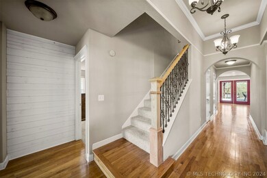 Beautiful entry with hardwood floors and staircase