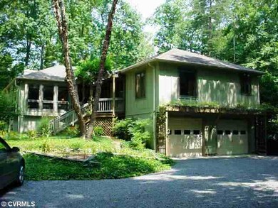 Exterior Front - A natural sidewalk leads to a bea