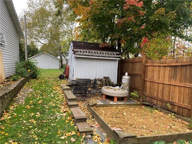 Storage shed, sandbox and play area