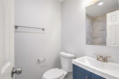 Bathroom featuring toilet and vanity