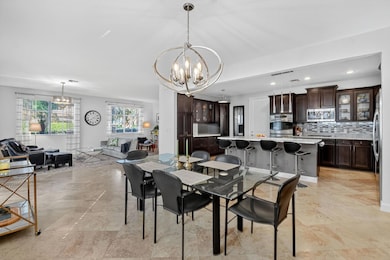 Open main level with dining, living room, kitchen, 1/2 bath, and bedroom!