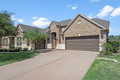 The stone and brick elevation along with the split 3 car garage enhances the curb appeal.