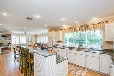 Kitchen with large window overlooking the pool, fa