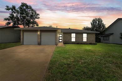 View of front of house featuring concrete drivewa