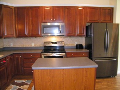 Kitchen with island, and all new appliances.