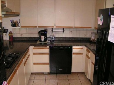 Kitchen features a newer dishwasher and granite co