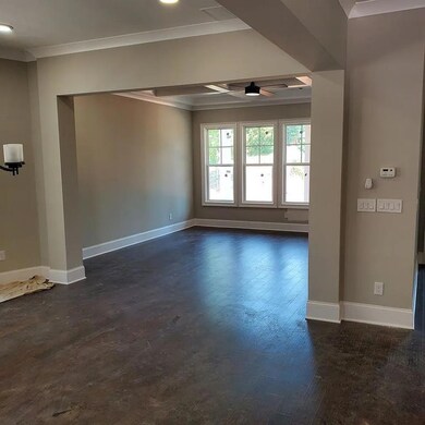 Spare room featuring crown molding, dark wood-style flooring, a ceiling fan, baseboards, and recessed lighting