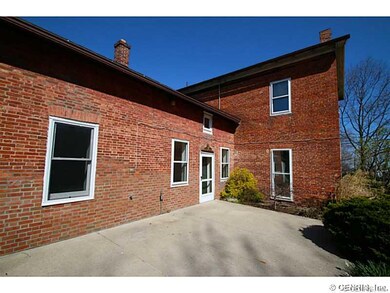 Exterior Back. Patio off dining room faces south