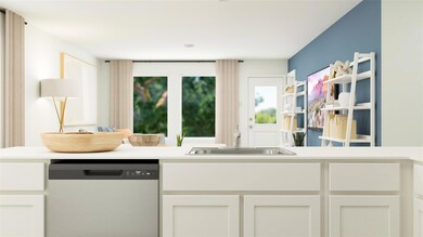 Kitchen featuring white cabinets, dishwasher, and sink