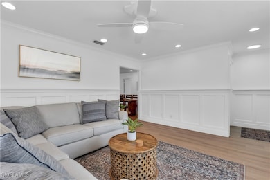 Living room featuring ornamental molding, ceiling