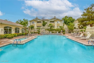 Pool featuring a patio and fence