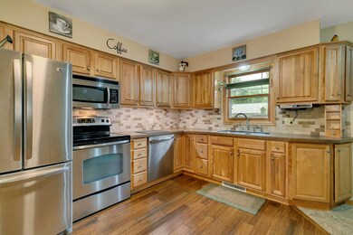 Pretty back splash with SS appliances.