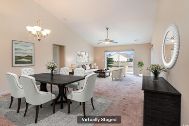 Dining room with light carpet, baseboards, high va
