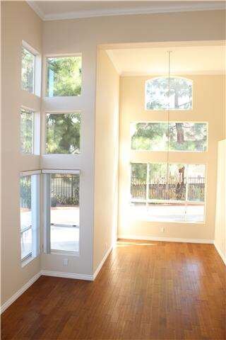 Dining room with cathedral ceilings, wall of windo