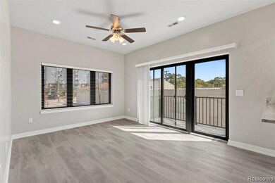 Spare room featuring light wood-style floors, ceiling fan, and recessed lighting