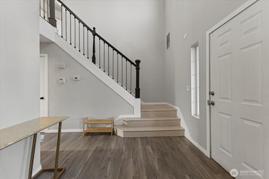 Open entry that leads upstairs, to the kitchen, or to the Great Room!