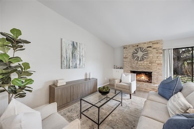 Living room featuring wood finished floors, lofte