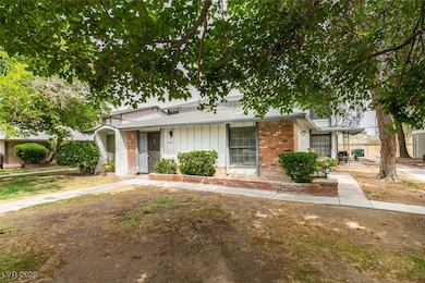 View of front of home with brick siding and board