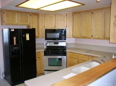 Convenient wrap around kitchen work area.