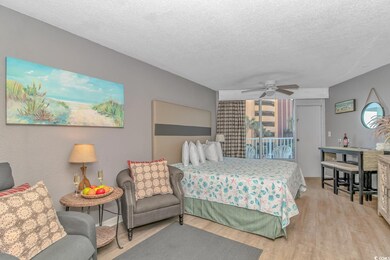 Bedroom with ceiling fan, light wood-type flooring