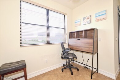 Home office featuring baseboards and tile patterne