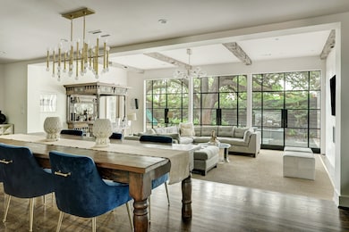 Another view highlighting the harmonious flow from the dining room towards the great room.