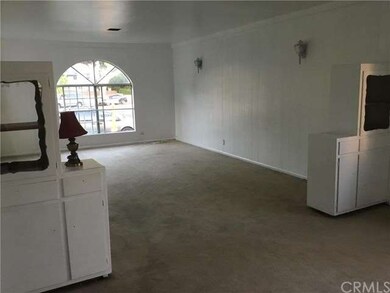 Living room (charming built-in cabinetry) connects