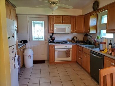 Kitchen including appliances. Door opens into extr