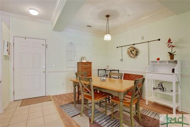 Dining Room has chair railing, unique lighting, an