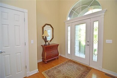 True entry space with hardwoods, coat closet and d