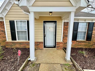 Property entrance with brick siding