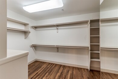 The walk-in closet is generously sized, offering p