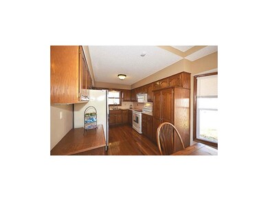 Well appointed kitchen with loads of cabinets.