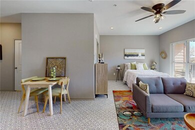 Bedroom featuring light carpet and recessed lighti