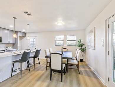 Dining room featuring sink, light hardwood / wood-