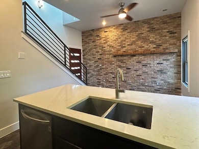 Kitchen with a sink, stainless steel dishwasher, 