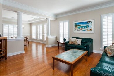 Living Room features custom moldings, beautiful wo