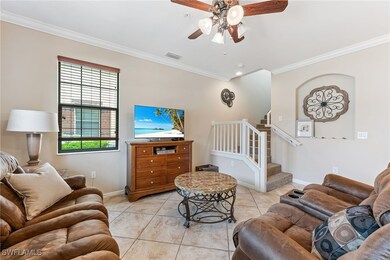Living area featuring ornamental molding, a ceilin